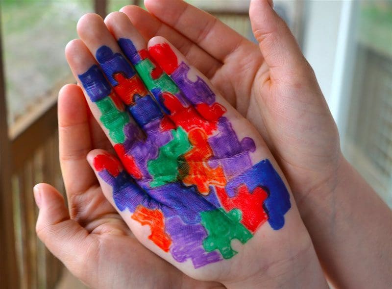 Hands painted for autism awareness.