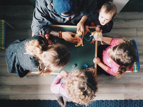 Children playing at a table.