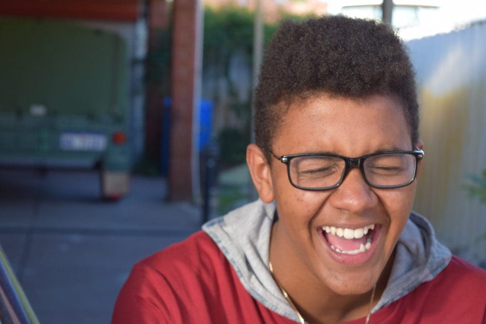 Teenager smiling.