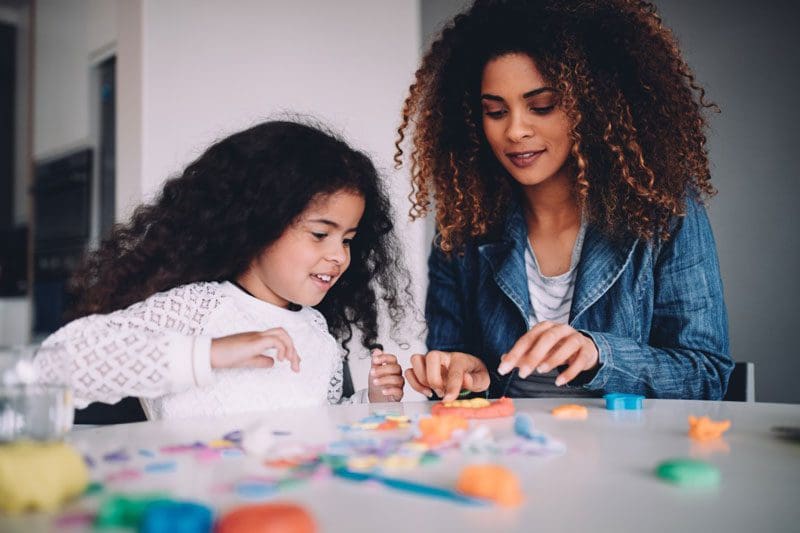 Mother and daughter playing together.