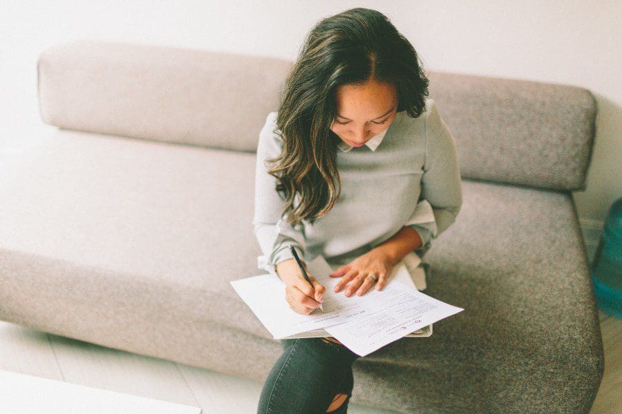 Woman filling out paperwork