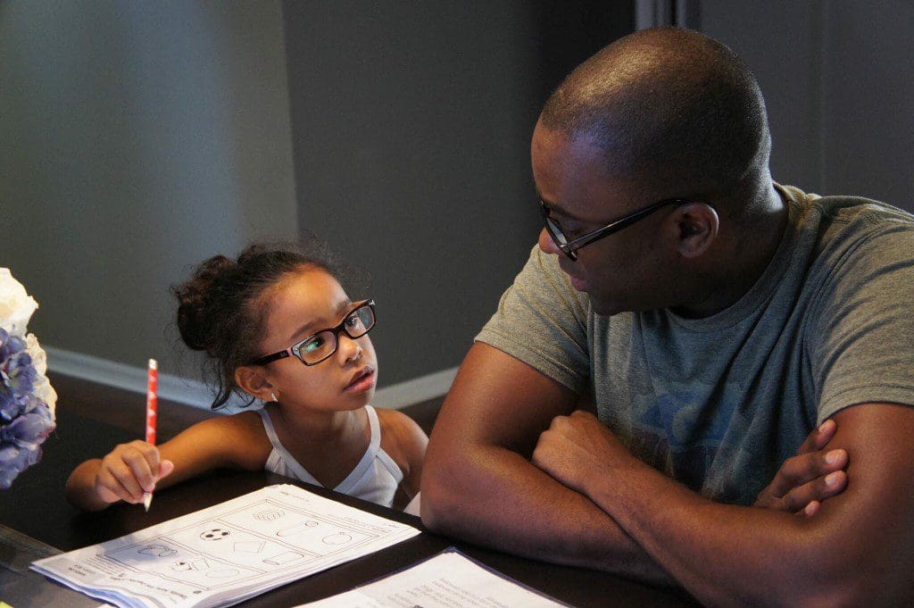 Adult and child doing homework