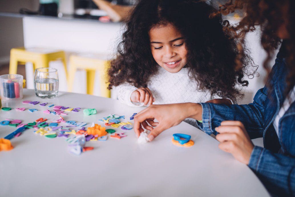 Adult and child playing