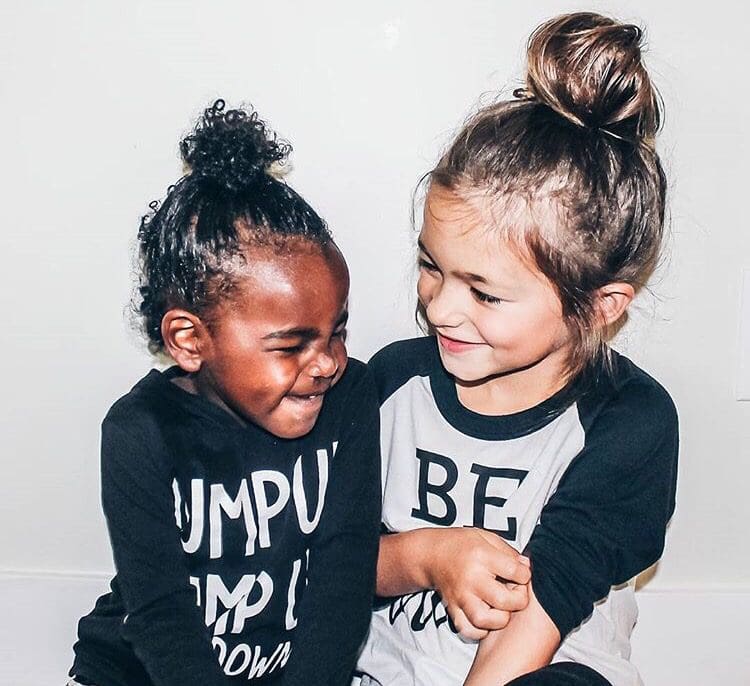 Two children smiling
