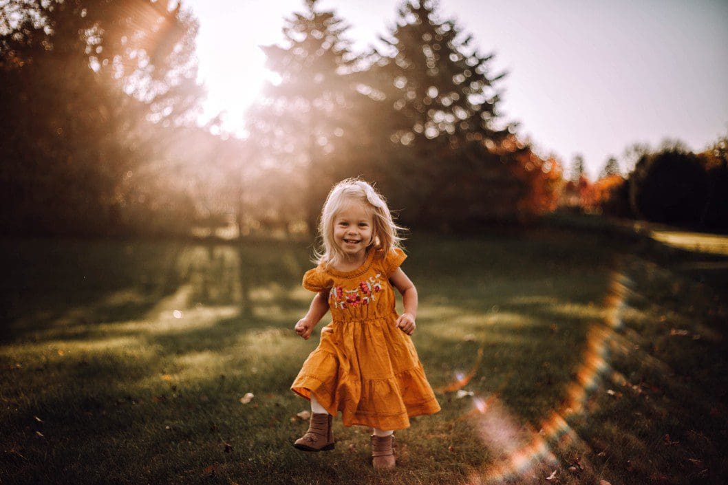 little girl in grass