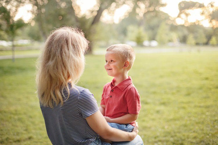 Mother and son sitting and talking