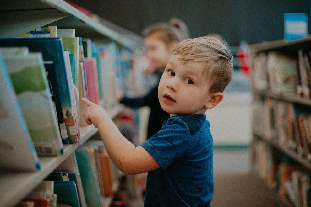 Child choosing a library book