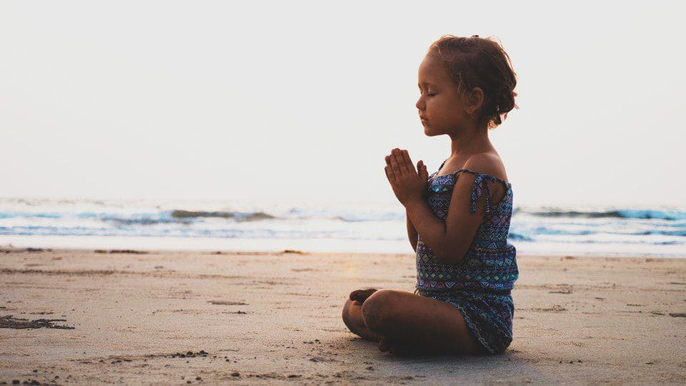 Child meditating for therapy.