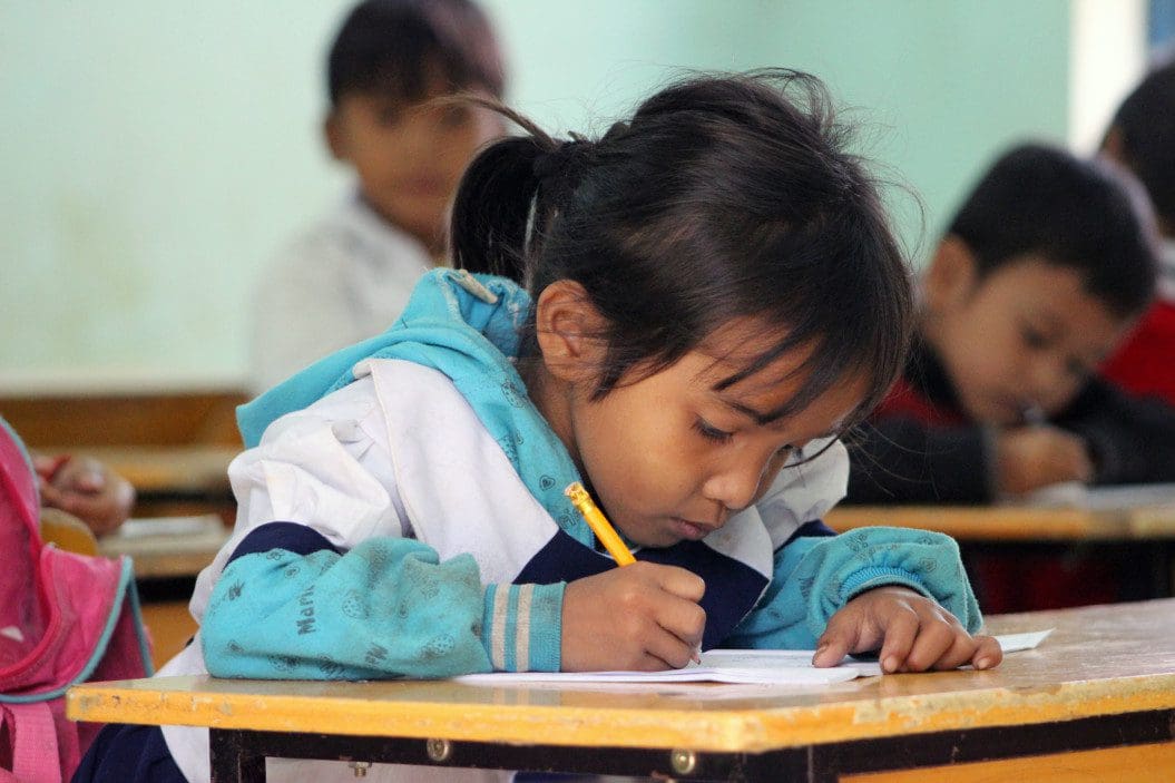 Girl in classroom.