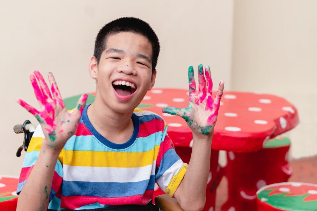Child finger painting.