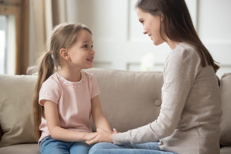 A parent explains autism to a child