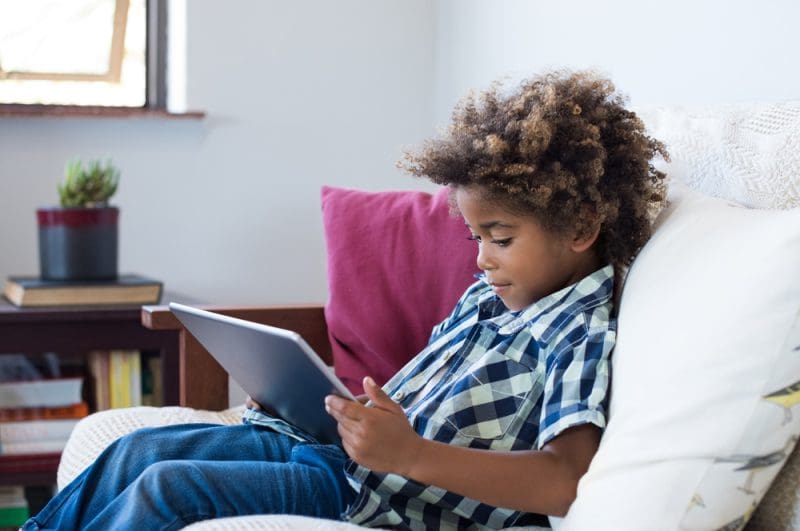 Child playing with tablet