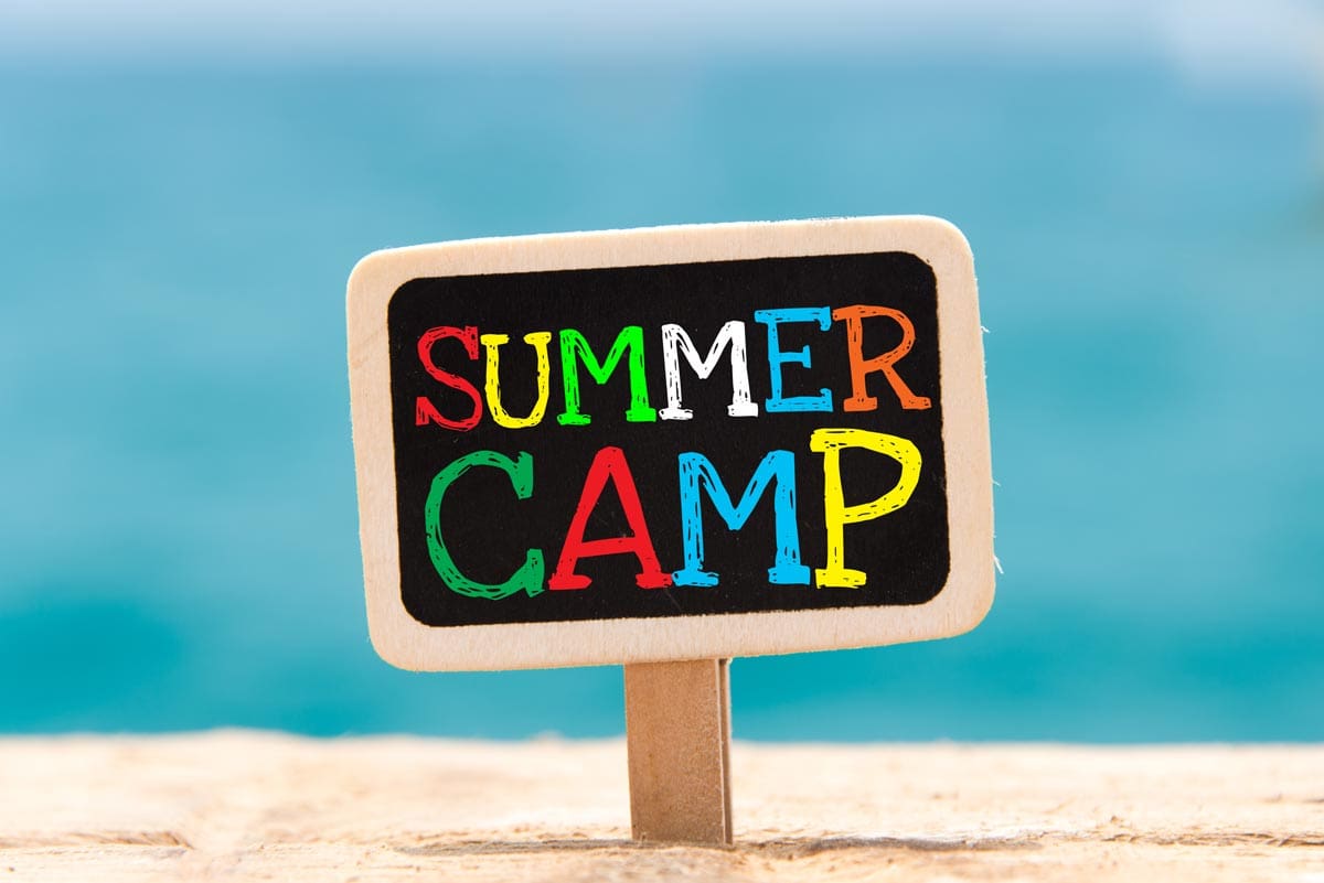 A sign says summer camp