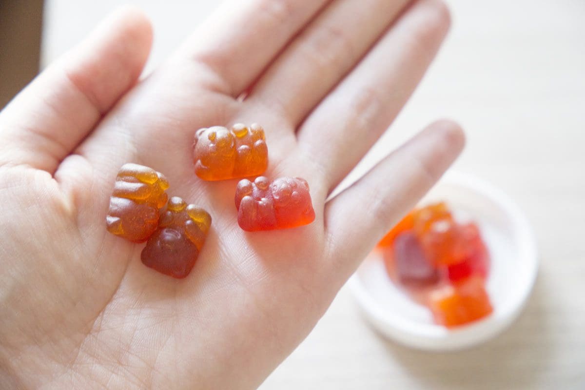 A child holds vitamins for autistic kids